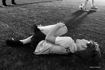 Athlete holding their leg in pain