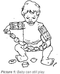 baby playing with arm restraints